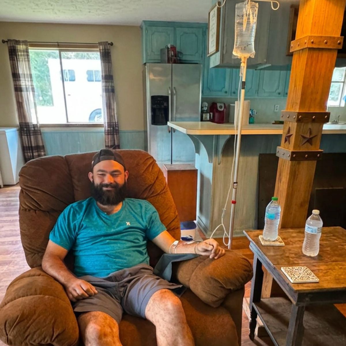 A client relaxing in his recliner during an in-home IV
