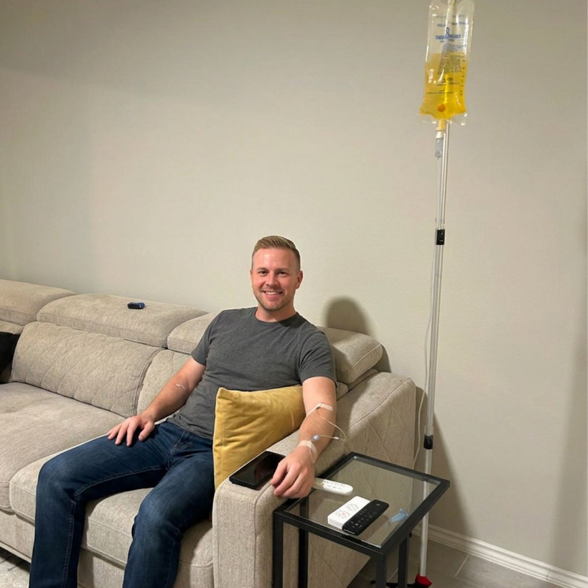 A client relaxing on his sectional during an in-home IV